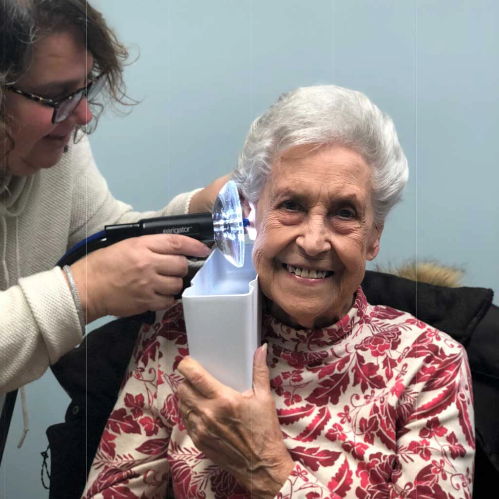Hearing aid cleaning and ear washing systems for home use